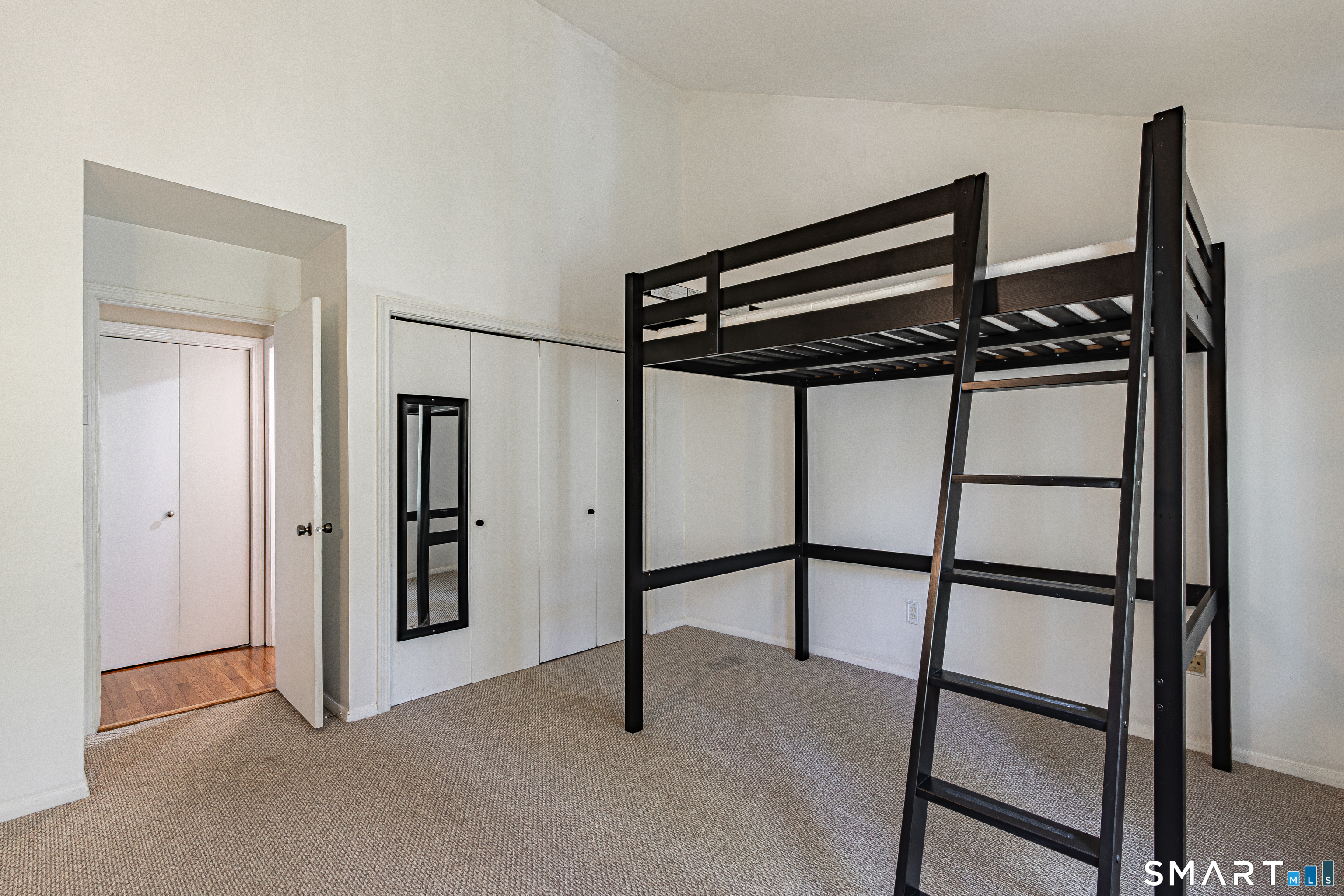 127 Old Farms Road, Unit 127 Torrington, CT 06790 - Photo 20 of 32 a view of a hallway