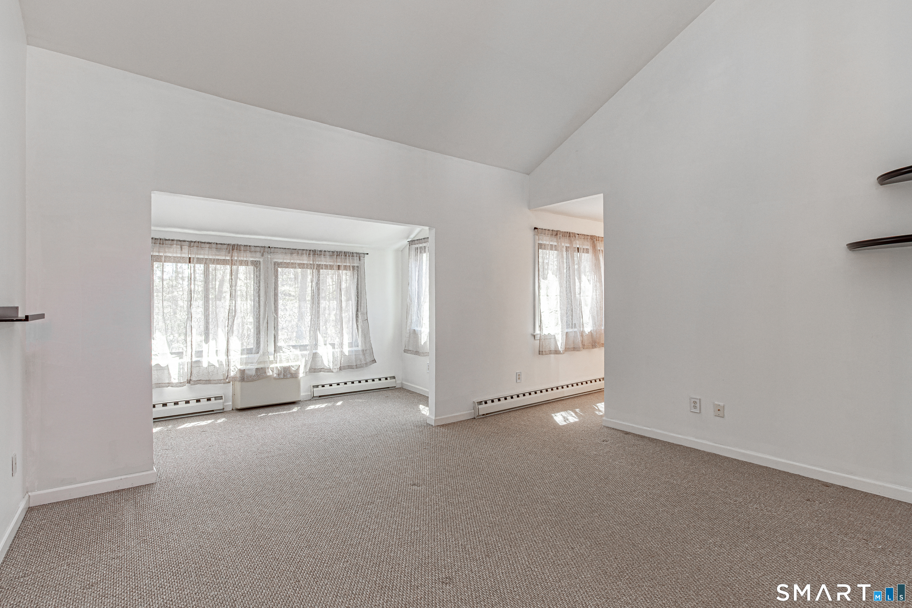 127 Old Farms Road, Unit 127 Torrington, CT 06790 - Photo 23 of 32 an empty room with windows