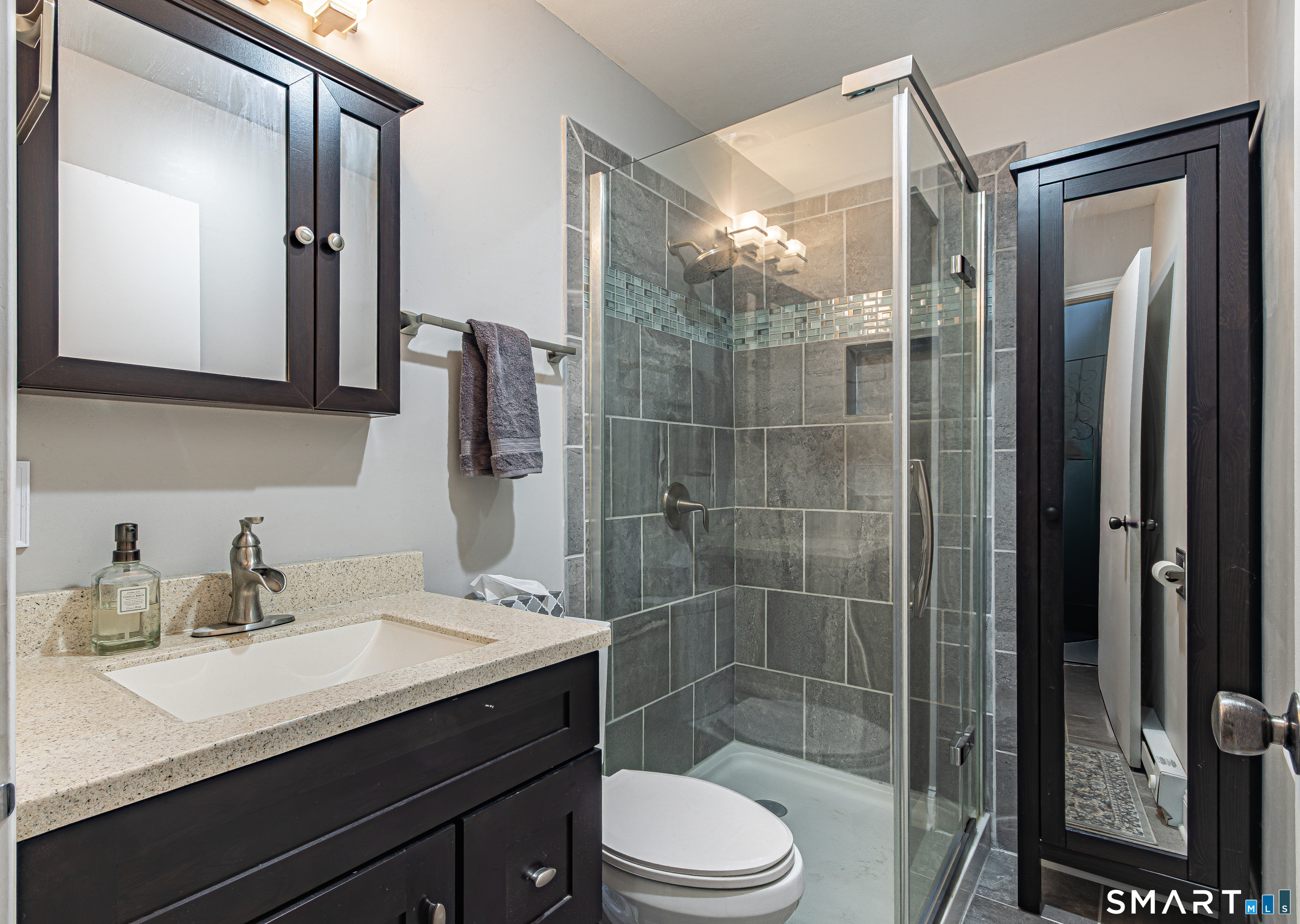 127 Old Farms Road, Unit 127 Torrington, CT 06790 - Photo 28 of 32 a bathroom with a sink a toilet and shower