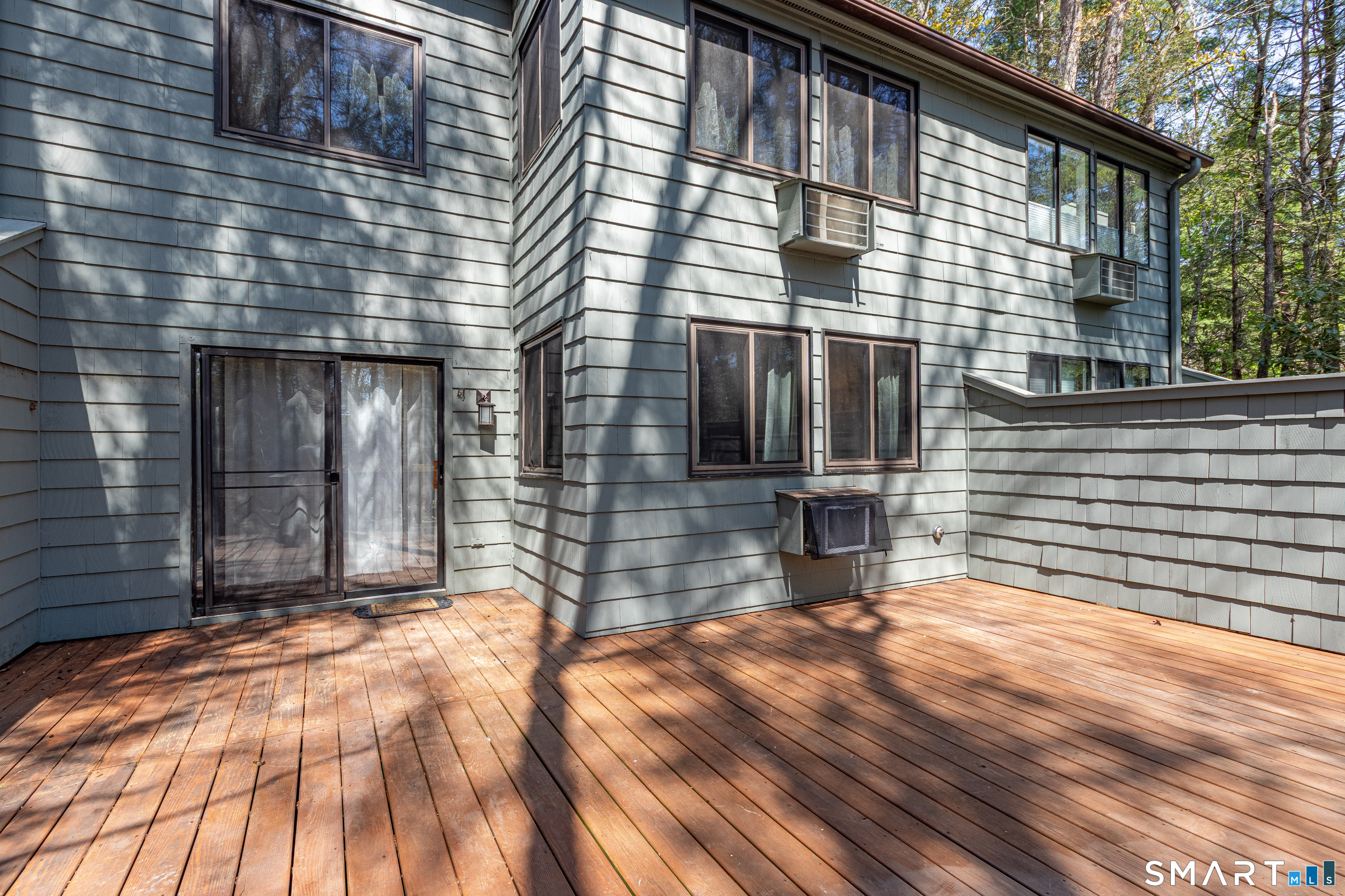 127 Old Farms Road, Unit 127 Torrington, CT 06790 - Photo 7 of 32 a view of house with backyard and deck