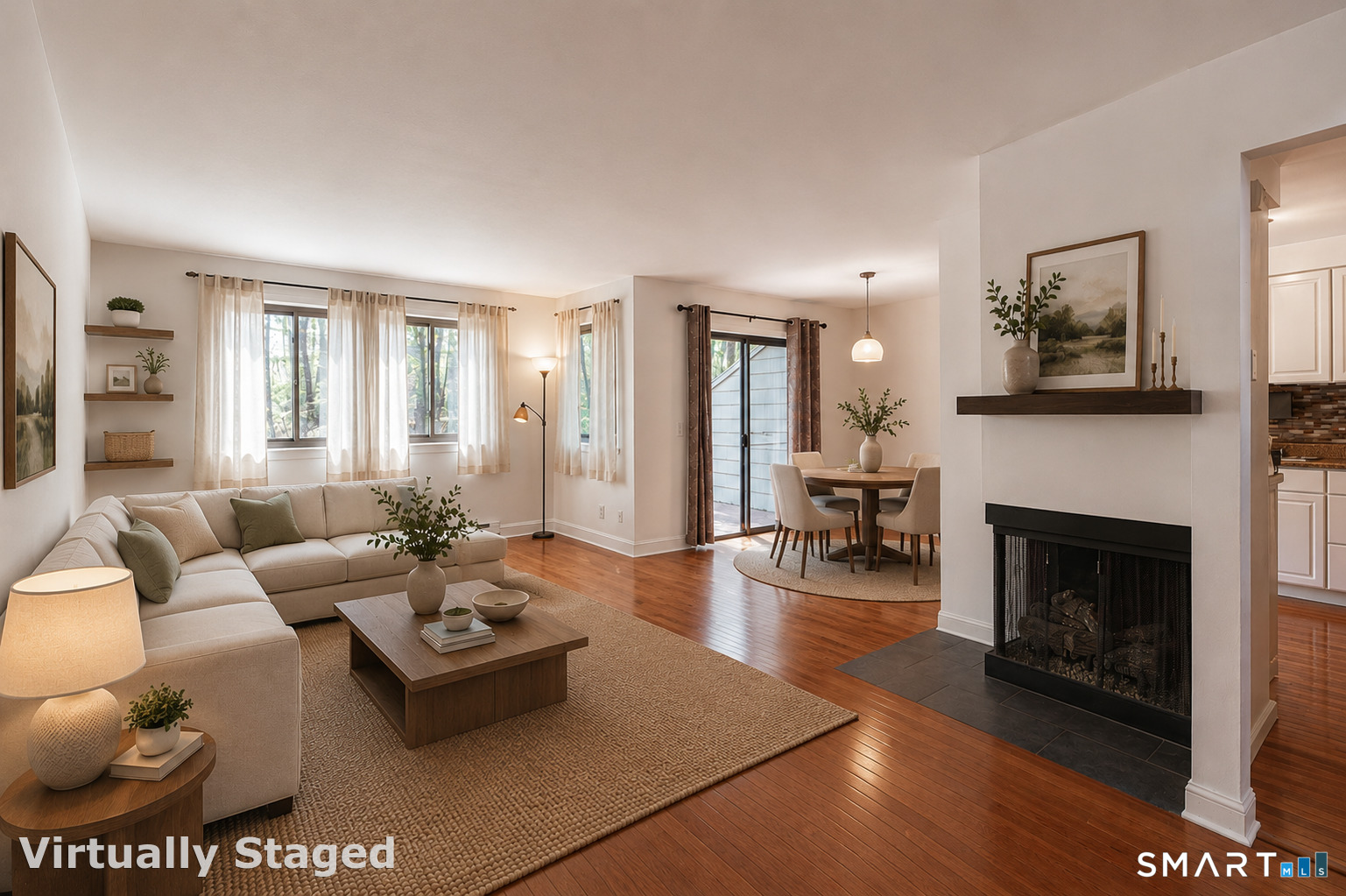 127 Old Farms Road, Unit 127 Torrington, CT 06790 - Photo 10 of 32 a living room with furniture a fireplace and a table