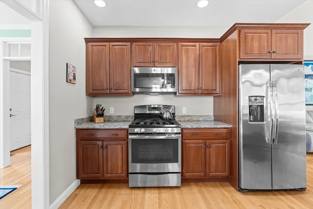 a kitchen with a stove and a refrigerator