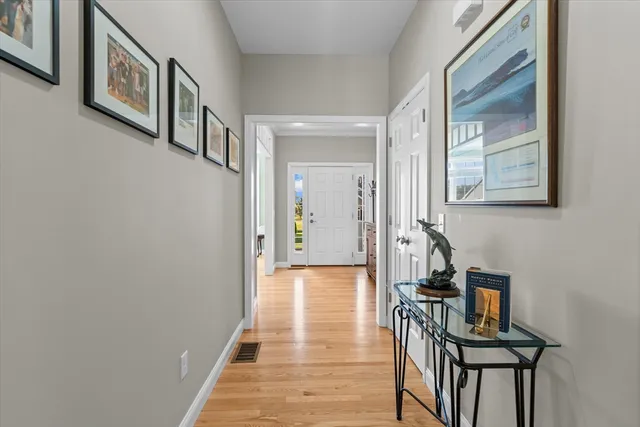 a view of a hallway with seating area