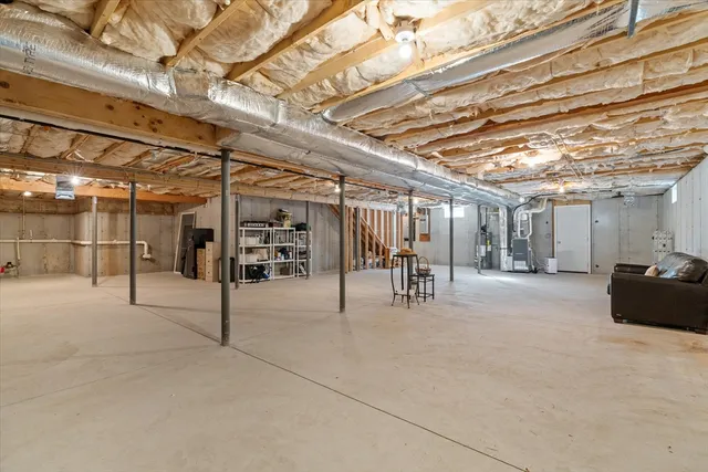 a view of a studio with wooden shelves