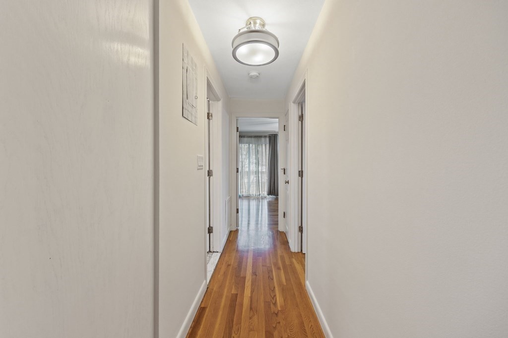 224 School Street, Unit 10 Walpole, MA 02081 - Photo 12 of 41 a view of a hallway with wooden floor
