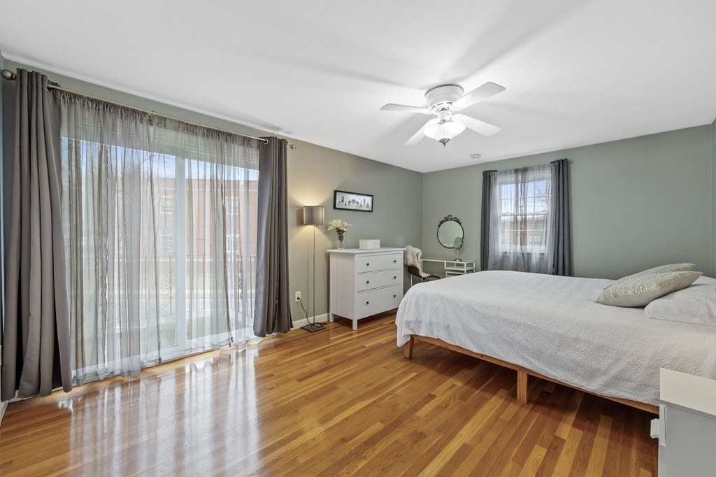 224 School Street, Unit 10 Walpole, MA 02081 - Photo 16 of 41 a bedroom with a bed and window