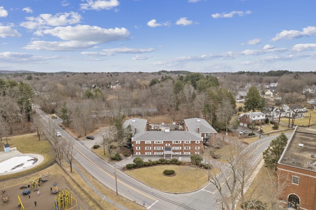 224 School Street, Unit 10 Walpole, MA 02081 - Photo 25 of 41 a view of a balcony with chair and wooden floor