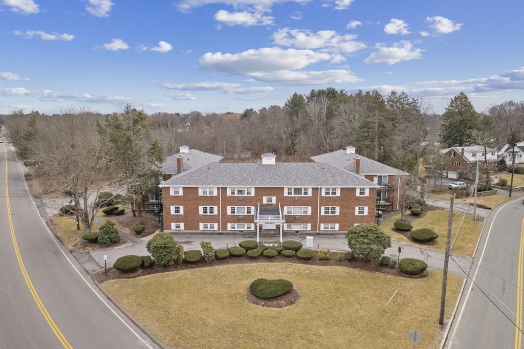 224 School Street, Unit 10 Walpole, MA 02081 - Photo 26 of 41 a view of a house with swimming pool and mountains in the background