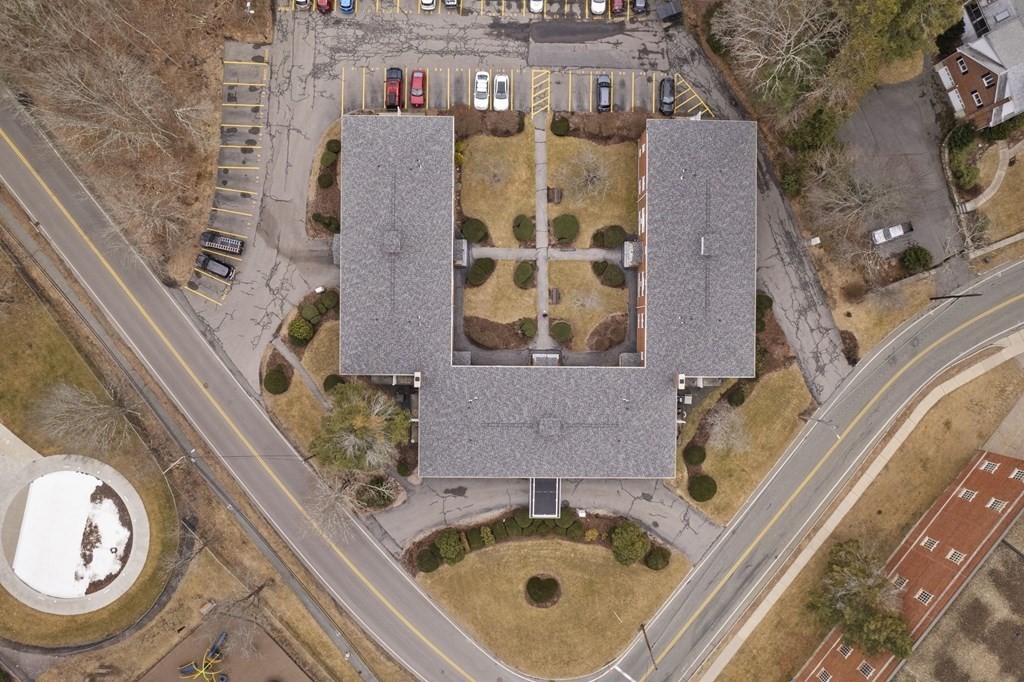 224 School Street, Unit 10 Walpole, MA 02081 - Photo 27 of 41 an aerial view of a house with a swimming pool