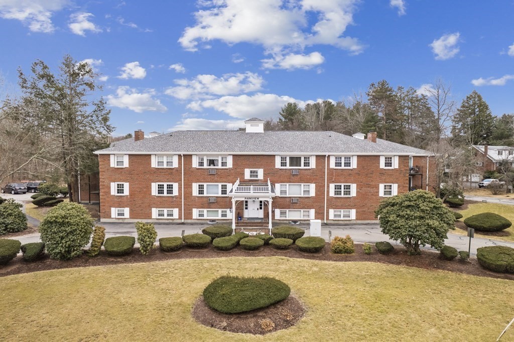 224 School Street, Unit 10 Walpole, MA 02081 - Photo 32 of 41 a view of a building with a garden