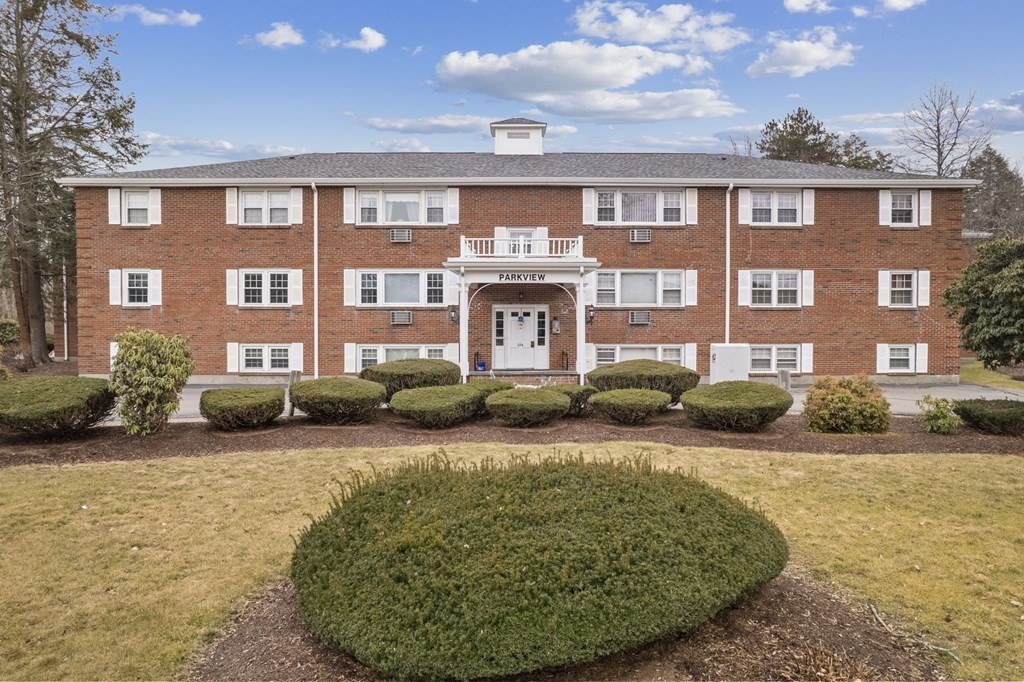 224 School Street, Unit 10 Walpole, MA 02081 - Photo 33 of 41 a view of a building with a swimming pool