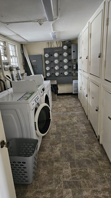 224 School Street, Unit 10 Walpole, MA 02081 - Photo 34 of 41 a bathroom with a granite countertop sink a washer and dryer