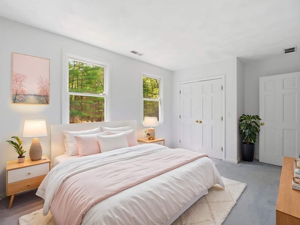 10 Hawk Ridge Road Andover, MA 01810 - Photo 19 of 32 a bedroom with a bed and a window