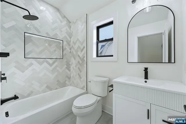 a bathroom with a toilet sink and bathtub