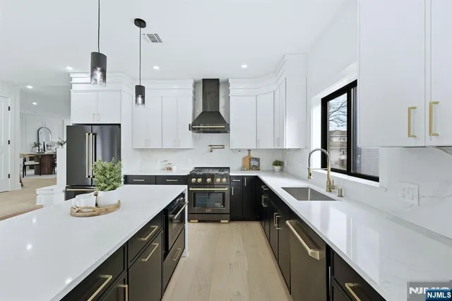 a kitchen with a sink stove and microwave
