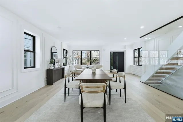 a view of a dining room with furniture and window