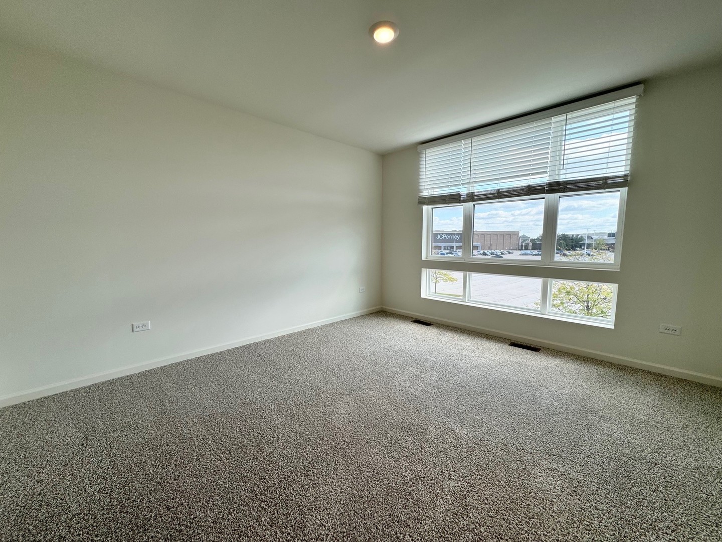387 Summit Circle Lombard, IL 60148 - Photo 13 of 48 an empty room with a fireplace and large window