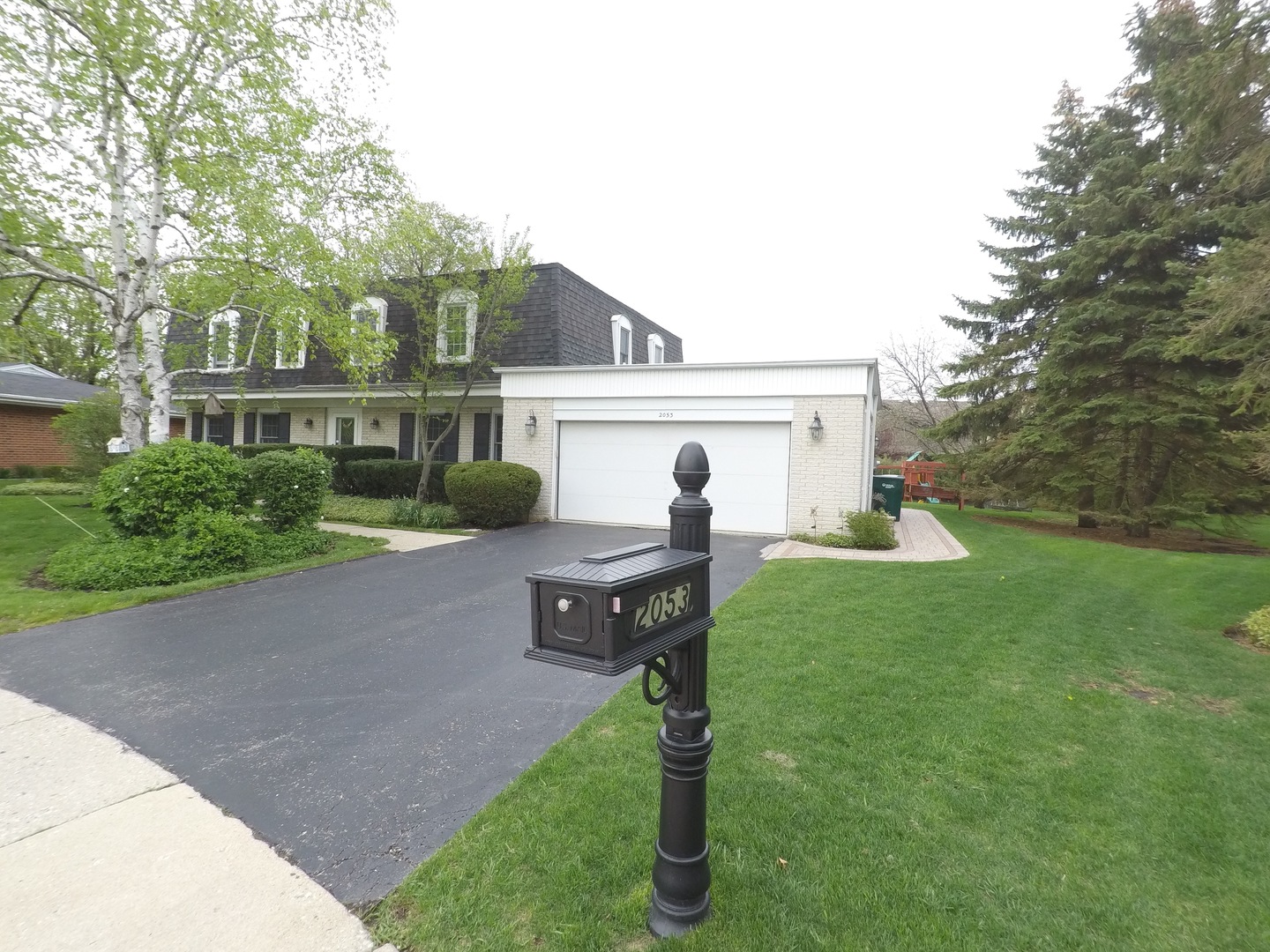 2053 Clover Road Northbrook, IL 60062 - Photo 1 of 28 a house view with a garden space