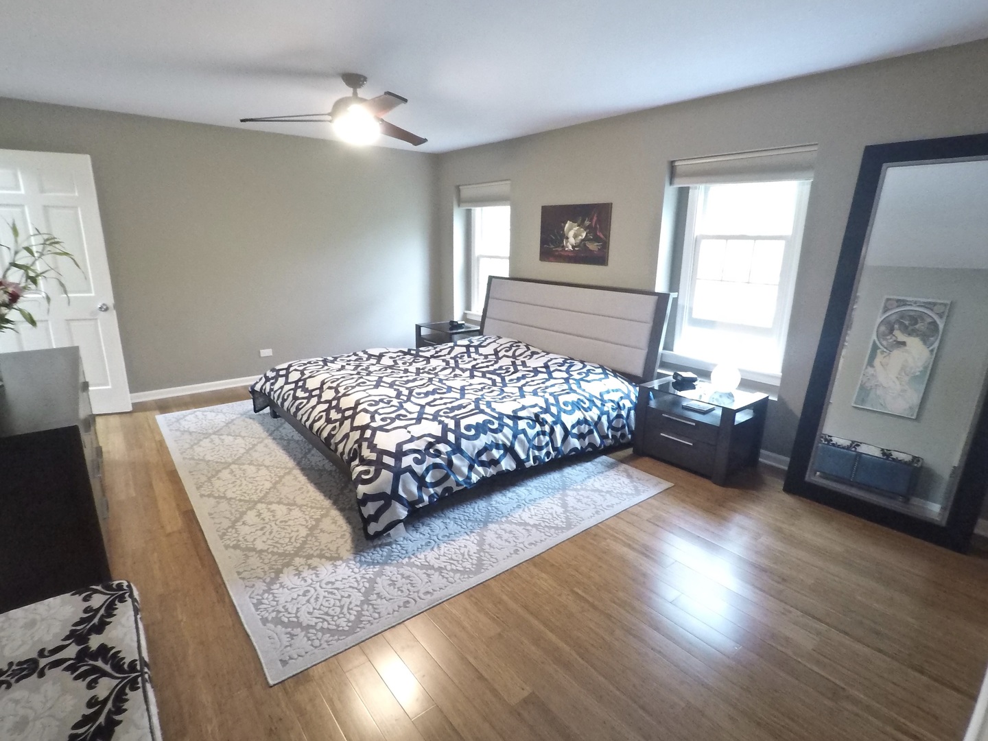 2053 Clover Road Northbrook, IL 60062 - Photo 16 of 28 a bedroom with a bed and wooden floor