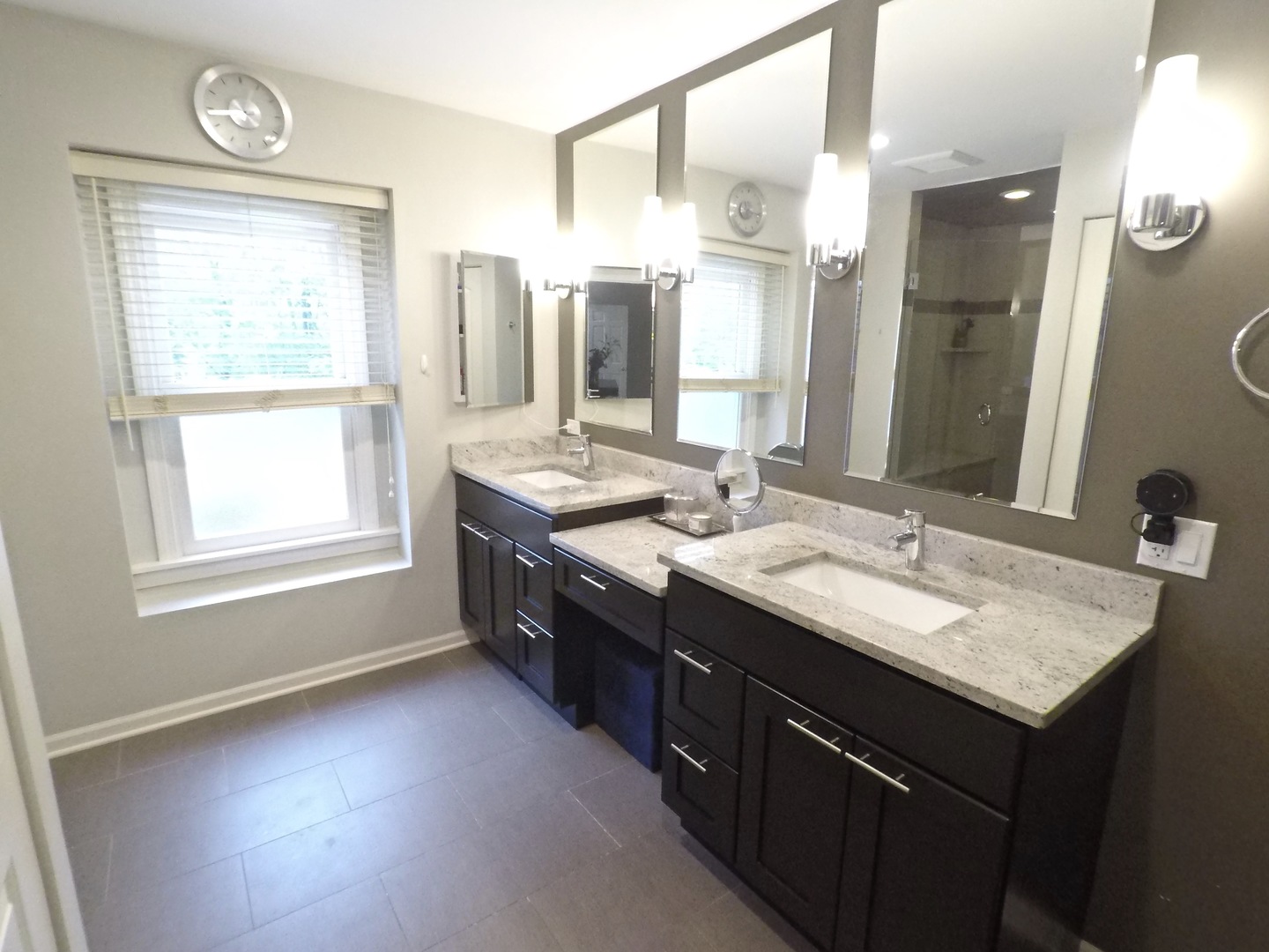 2053 Clover Road Northbrook, IL 60062 - Photo 18 of 28 a bathroom with a double vanity sink and a mirror