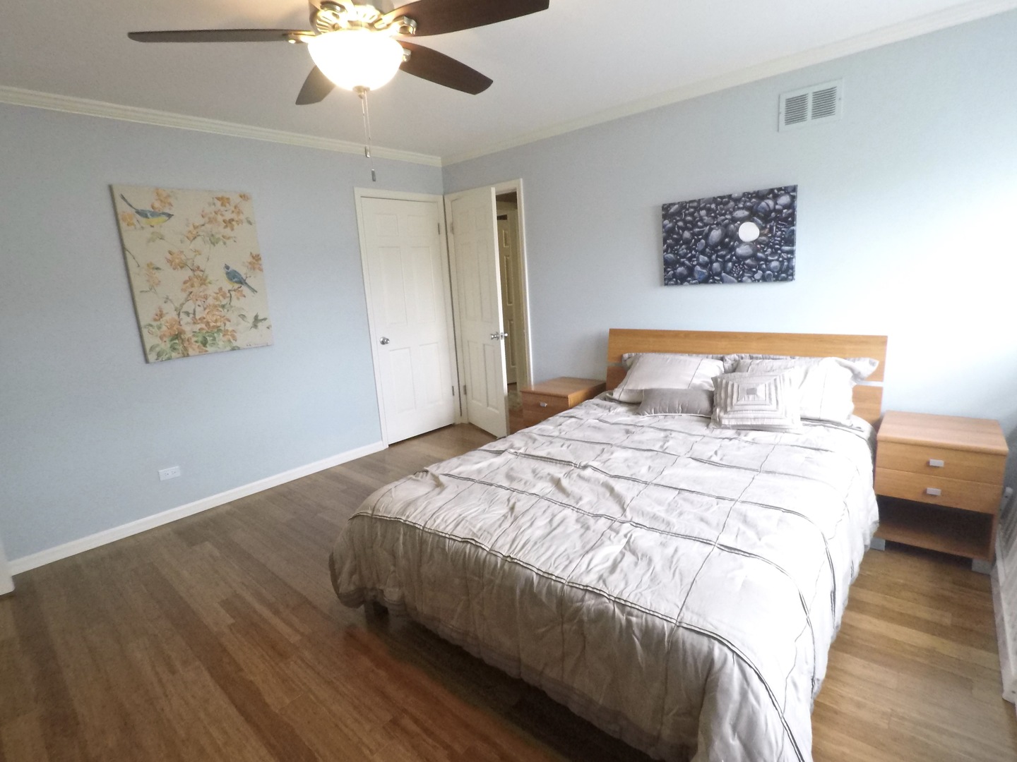 2053 Clover Road Northbrook, IL 60062 - Photo 21 of 28 a bedroom with a large bed and a ceiling fan