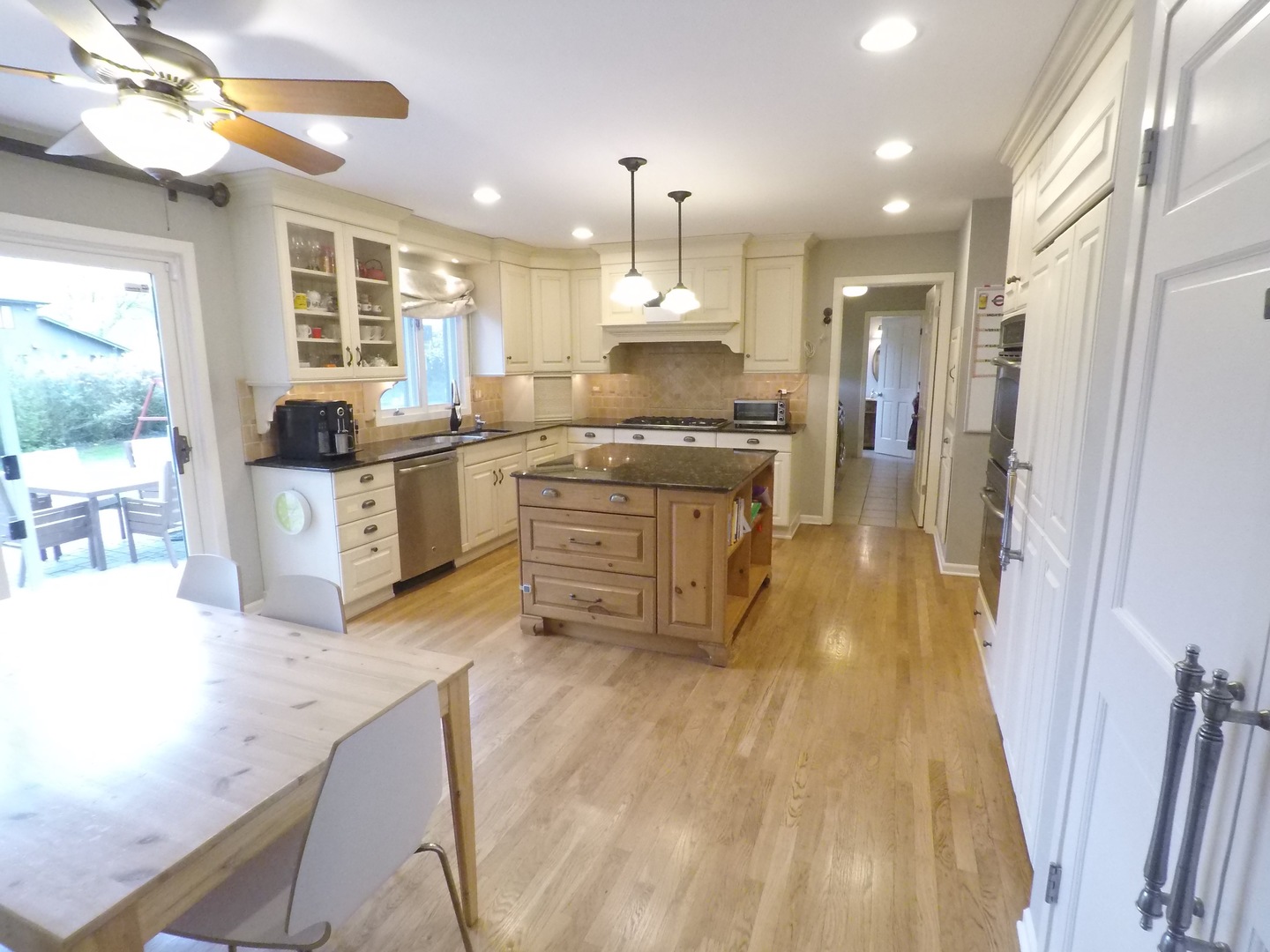 2053 Clover Road Northbrook, IL 60062 - Photo 6 of 28 a large kitchen with granite countertop a large counter top appliances and cabinets