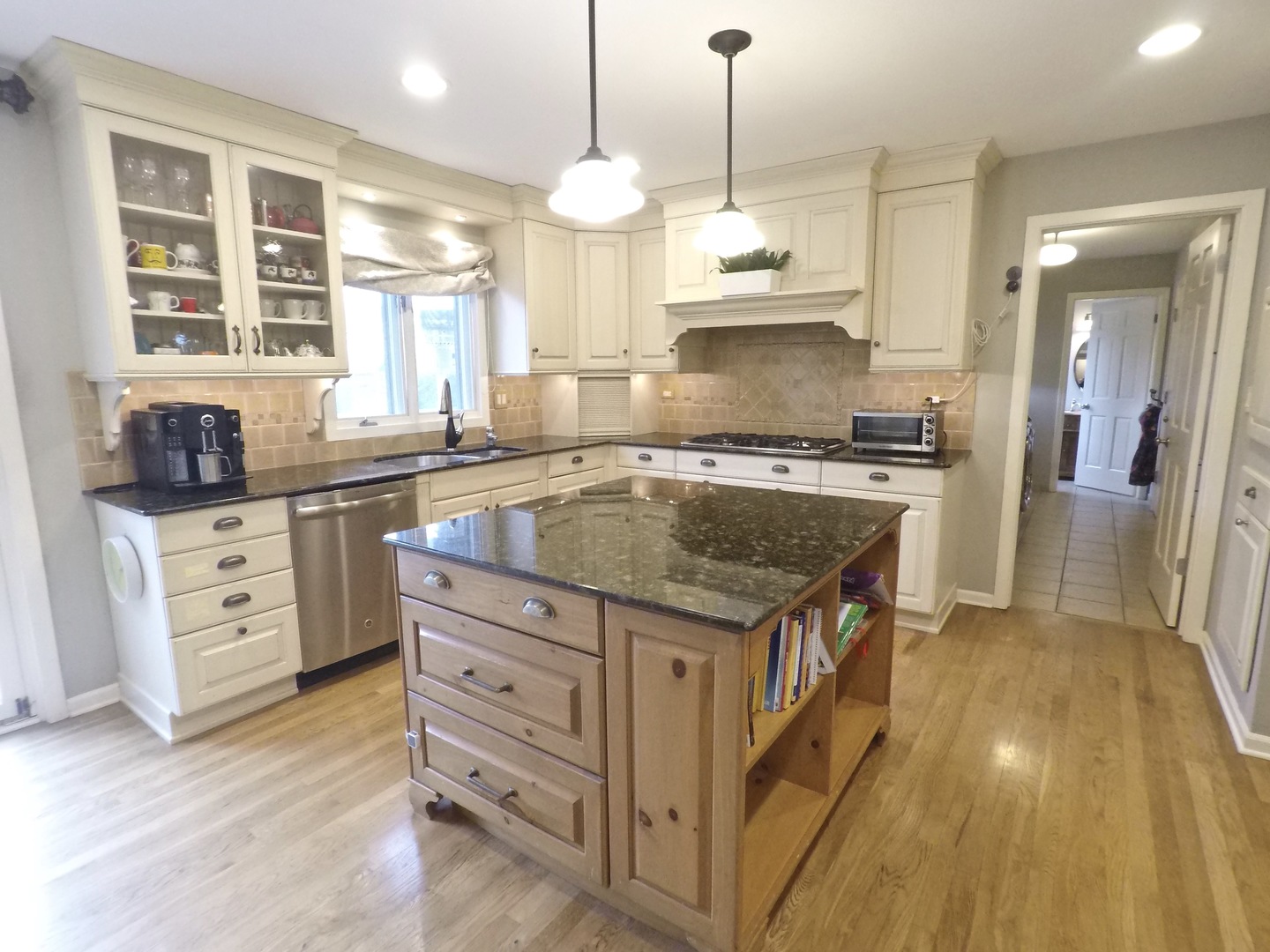 2053 Clover Road Northbrook, IL 60062 - Photo 7 of 28 a kitchen with stainless steel appliances granite countertop a stove a sink and a refrigerator