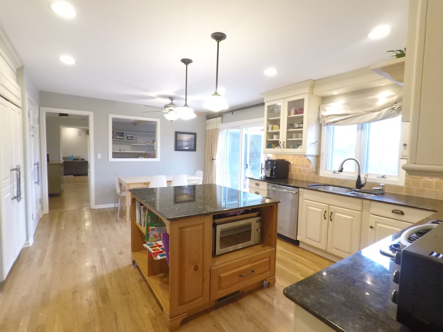 2053 Clover Road Northbrook, IL 60062 - Photo 8 of 28 a kitchen with stainless steel appliances granite countertop a stove and cabinets