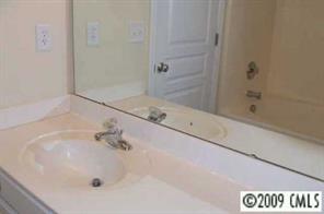 839 Gentlewinds Court, Unit 839 Fort Mill, SC 29708 - Photo 8 of 8 a white bath tub sitting next to a white sink