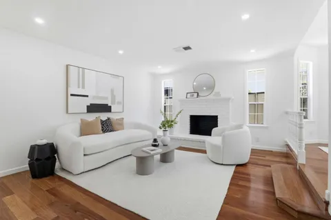 a living room with furniture fireplace and a fireplace