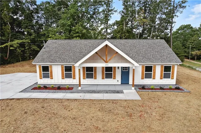 a house with trees in the background
