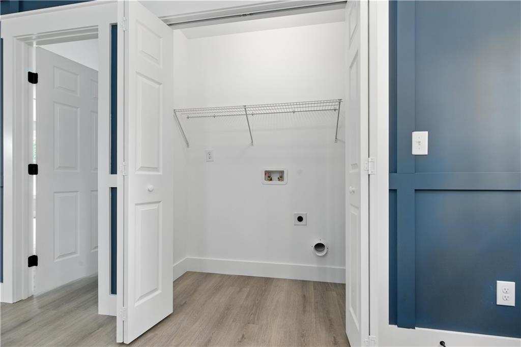 194 Harris Loop Dallas, GA 30157 - Photo 15 of 25 a view of a hallway with wooden floor