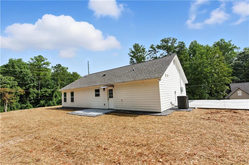 194 Harris Loop Dallas, GA 30157 - Photo 22 of 25 a view of a house with a yard