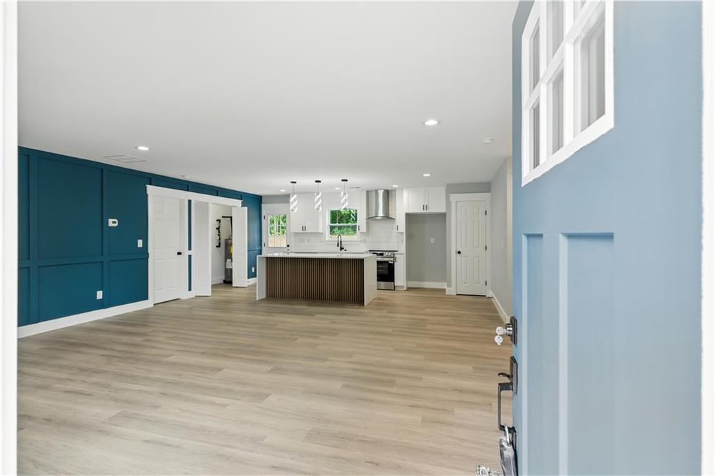 194 Harris Loop Dallas, GA 30157 - Photo 4 of 25 a view of a kitchen with a sink and a refrigerator