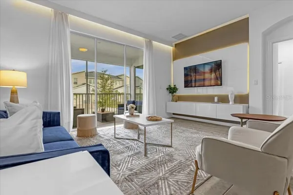 a living room with furniture and a flat screen tv
