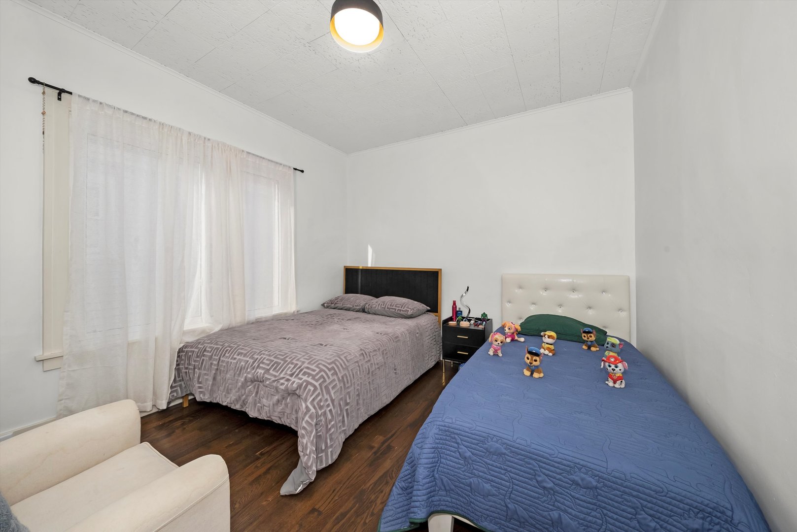 6514 Sinclair Avenue Berwyn, IL 60402 - Photo 13 of 33 a bedroom with a bed and a window