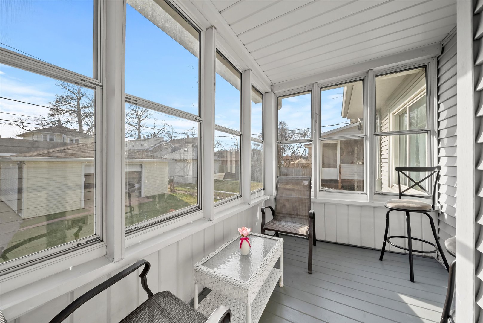 6514 Sinclair Avenue Berwyn, IL 60402 - Photo 25 of 33 a living room filled with furniture and floor to ceiling windows