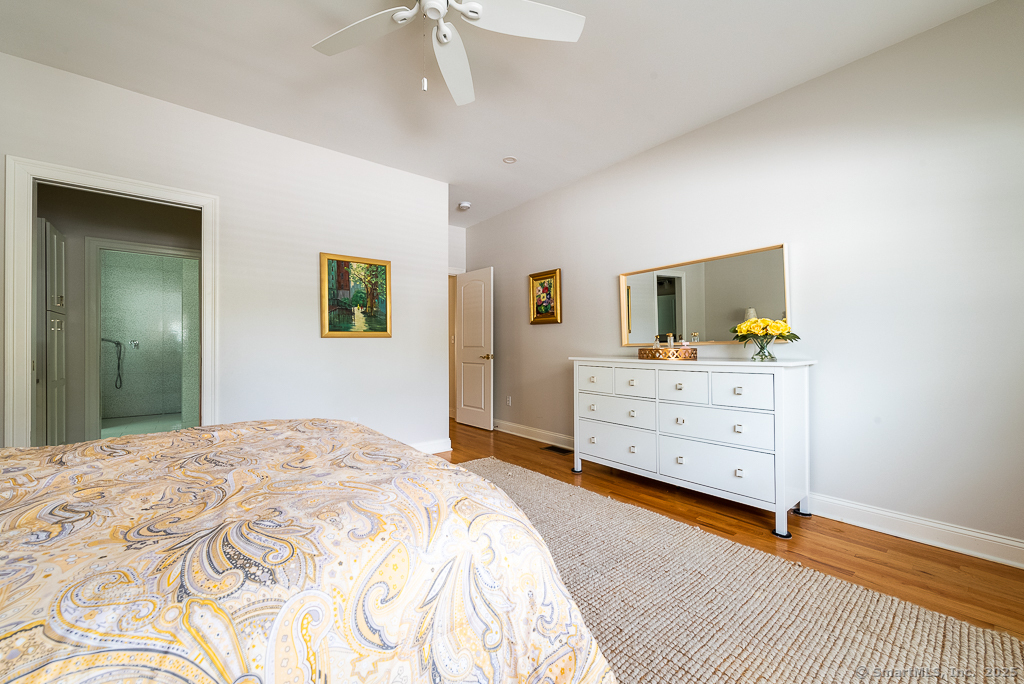 175 Ferry Road, Unit 3 Old Saybrook, CT 06475 - Photo 19 of 37 a bedroom with a bed and a dresser