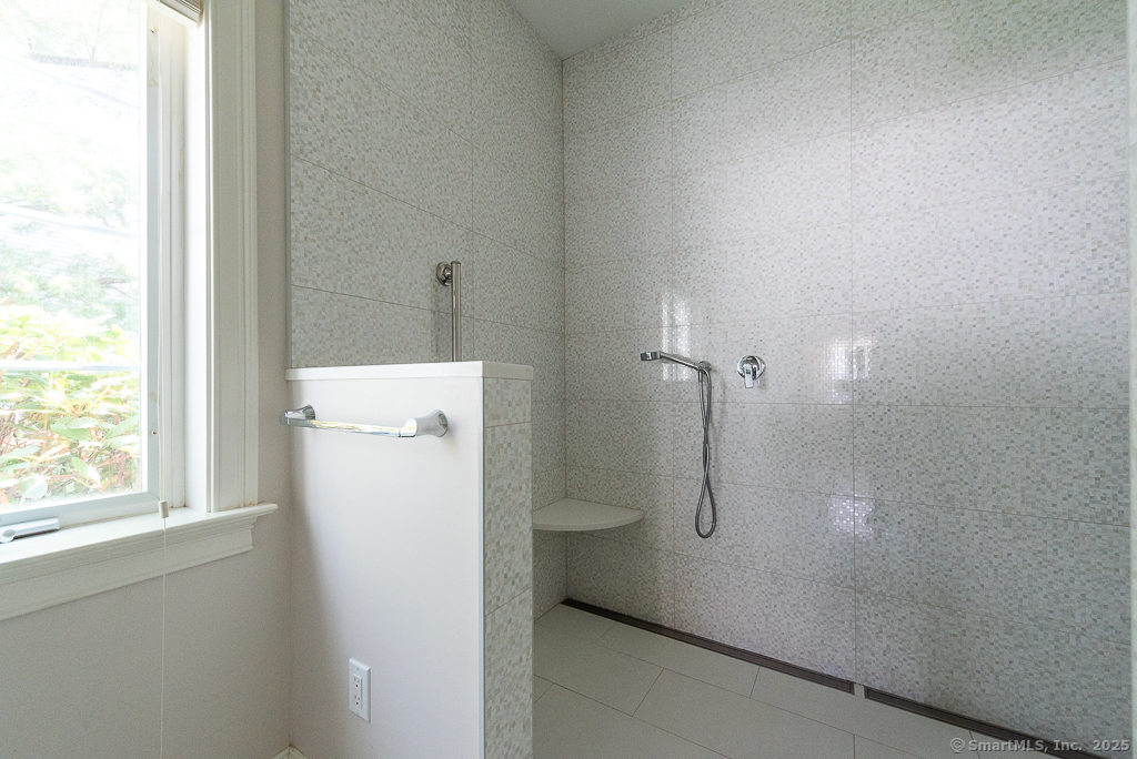 175 Ferry Road, Unit 3 Old Saybrook, CT 06475 - Photo 22 of 37 a bathroom with a shower and toilet