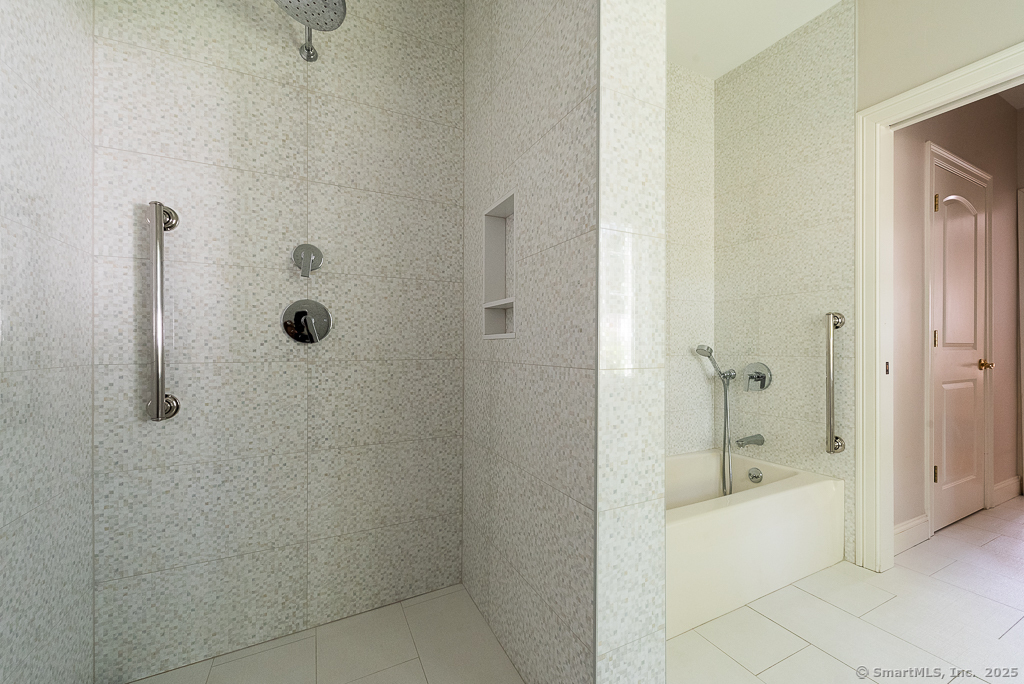 175 Ferry Road, Unit 3 Old Saybrook, CT 06475 - Photo 23 of 37 a bathroom with a bathtub and a shower