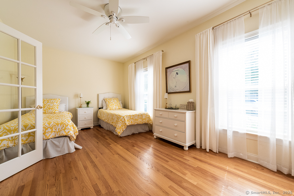 175 Ferry Road, Unit 3 Old Saybrook, CT 06475 - Photo 24 of 37 a bedroom with furniture and a large window