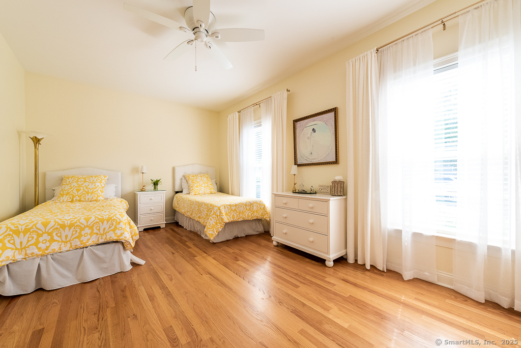 175 Ferry Road, Unit 3 Old Saybrook, CT 06475 - Photo 25 of 37 a spacious bedroom with a bed and a window