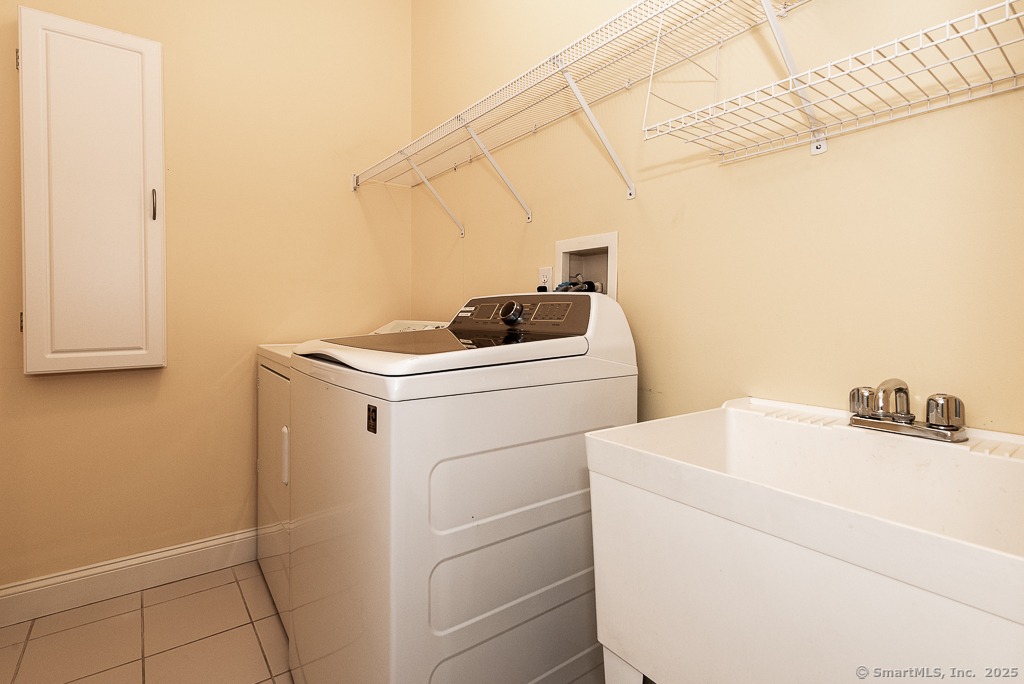 175 Ferry Road, Unit 3 Old Saybrook, CT 06475 - Photo 30 of 37 a utility room with dryer and washer