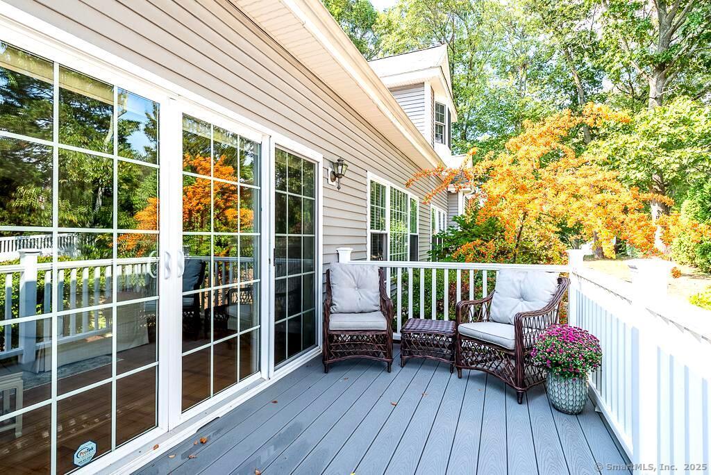 175 Ferry Road, Unit 3 Old Saybrook, CT 06475 - Photo 31 of 37 a view of balcony with wooden floor and seating space