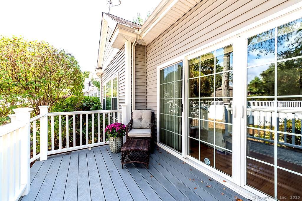 175 Ferry Road, Unit 3 Old Saybrook, CT 06475 - Photo 32 of 37 a view of balcony with wooden floor and seating space