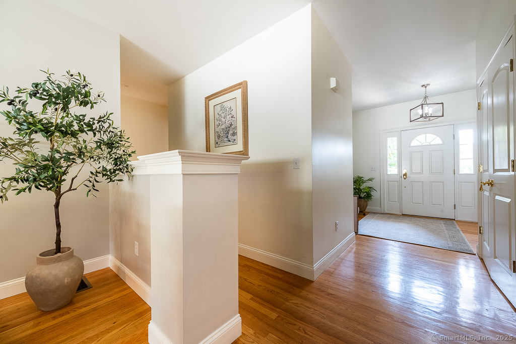 175 Ferry Road, Unit 3 Old Saybrook, CT 06475 - Photo 5 of 37 a view of entryway with wooden floor
