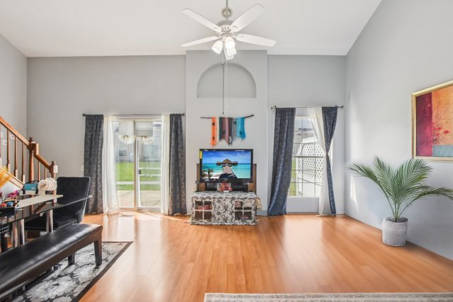 3407 Sandpiper Drive Aurora, IL 60504 - Photo 3 of 20 a living room with furniture and a flat screen tv