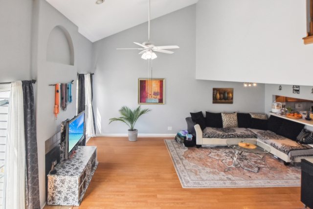 3407 Sandpiper Drive Aurora, IL 60504 - Photo 6 of 20 a living room with furniture and a fireplace