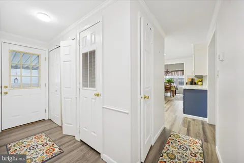 a view of hallway with wooden floor