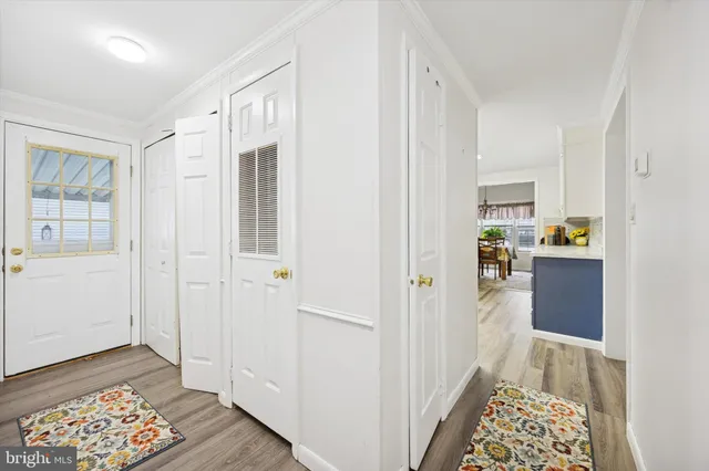 a view of hallway with wooden floor